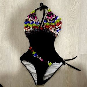 Beautiful one piece bathing suit with open back.
